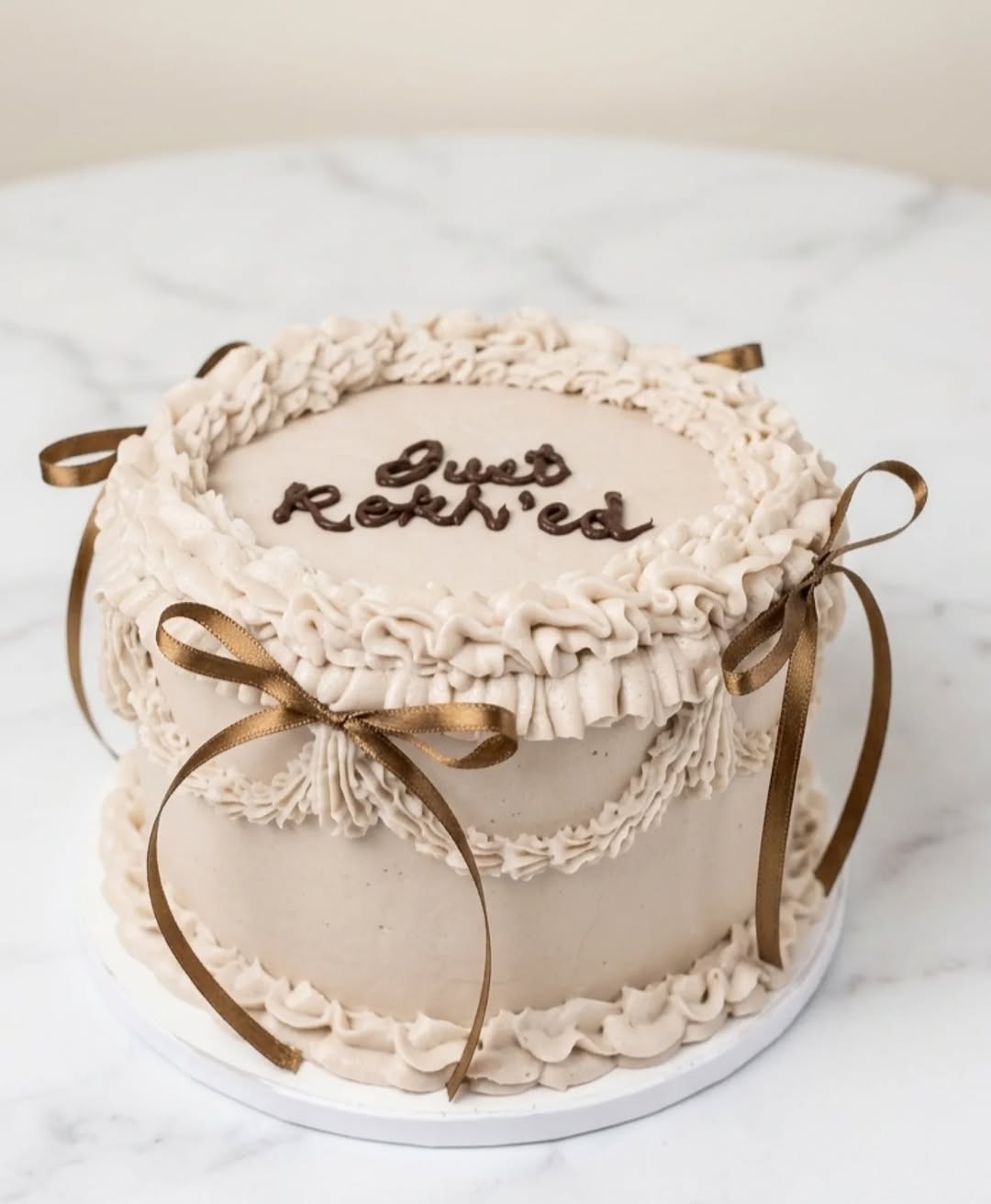 Custom celebration cake with gold lettering