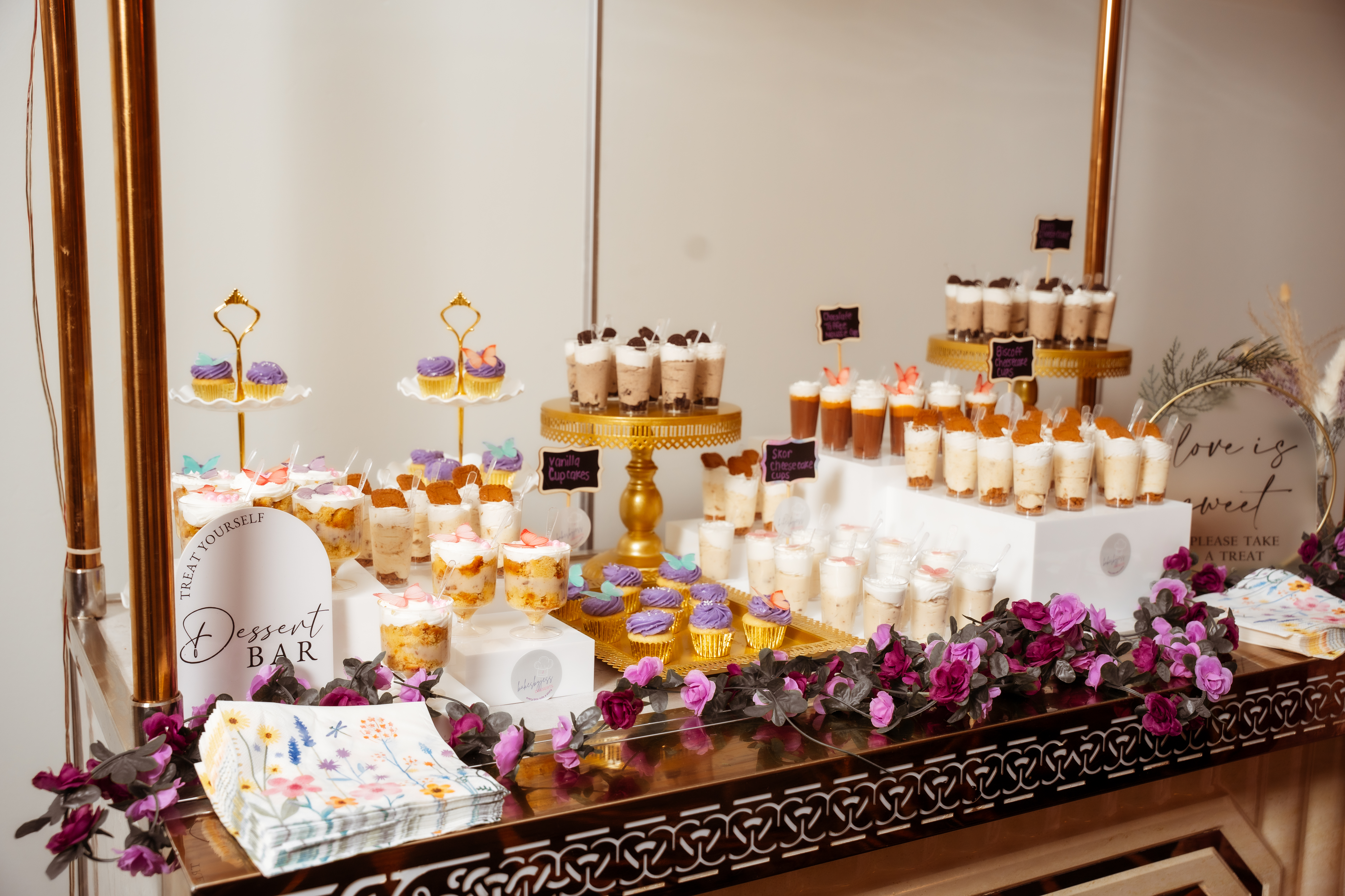 Full dessert bar display with cupcakes and dessert cups